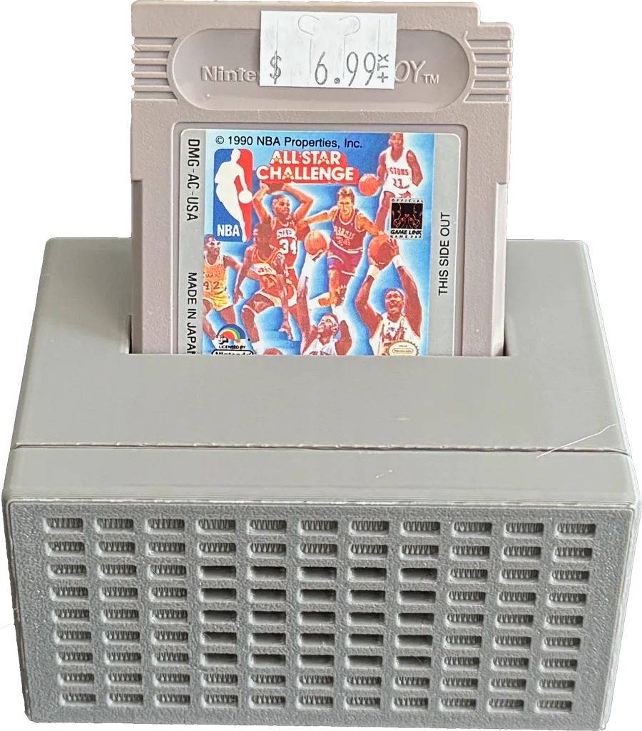 A Retro Song Bird speaker with a Game Boy cartridge plugged into the top